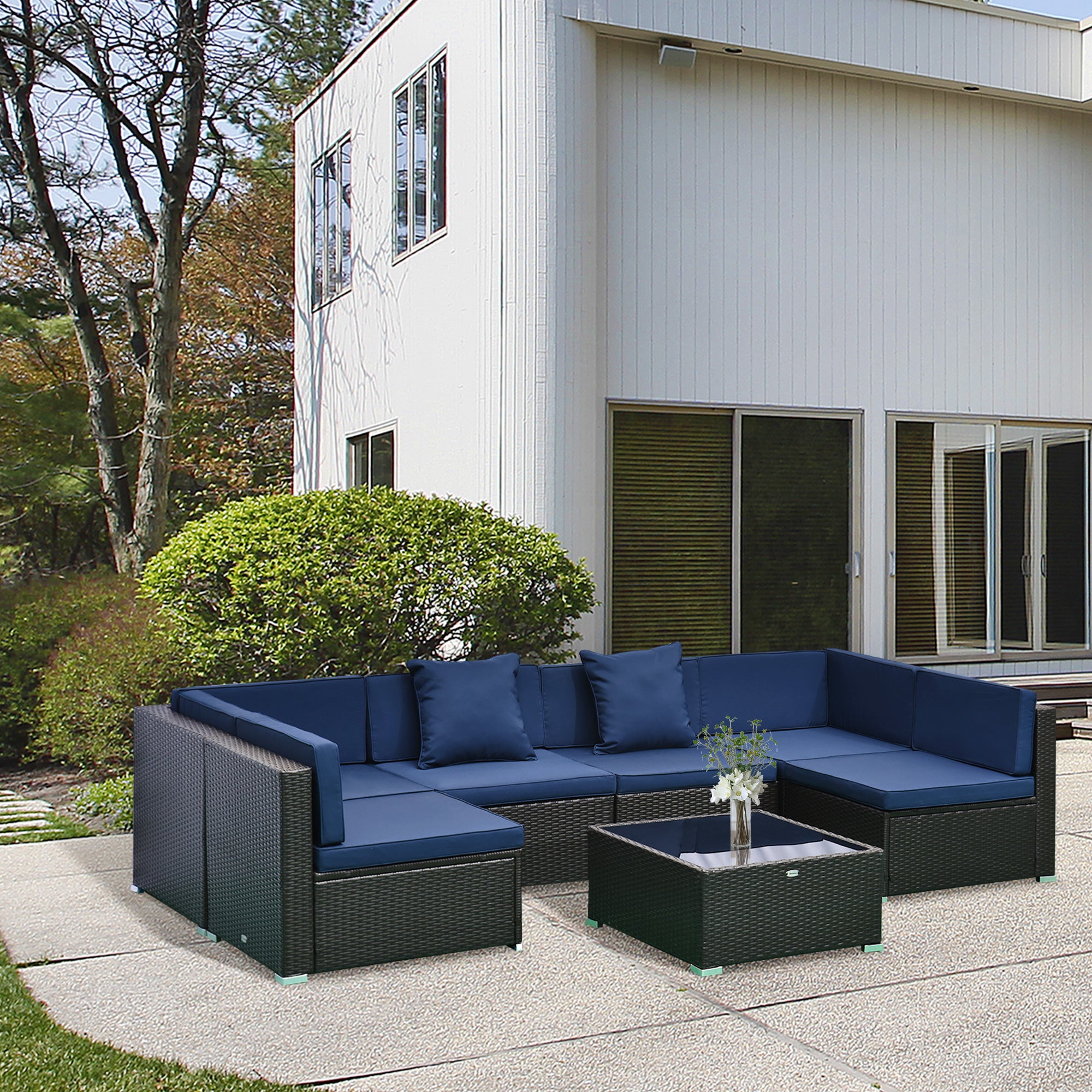 7-Piece Outdoor Rattan Patio Furniture Set with Ottoman & Glass Coffee Table – Dark Coffee Frame with Blue Cushions